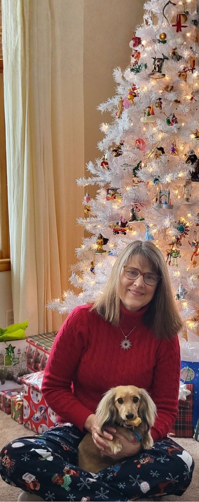 Amy with Charlotte in front of the Christmas tree